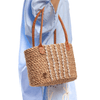 Halfa bag embroidered with leather handle with a seashell. حقيبة حلفا مطرزة بيد جلد مع صدف